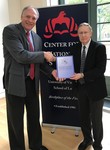 Managing editor, Russel Hirst presents copy of IJNS to David Graham of UVA